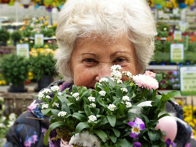 A resident holding a bunch of flowers