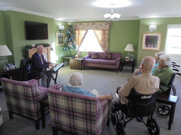 Our residents watching pianist Alan play at Harrier Grange Care Home