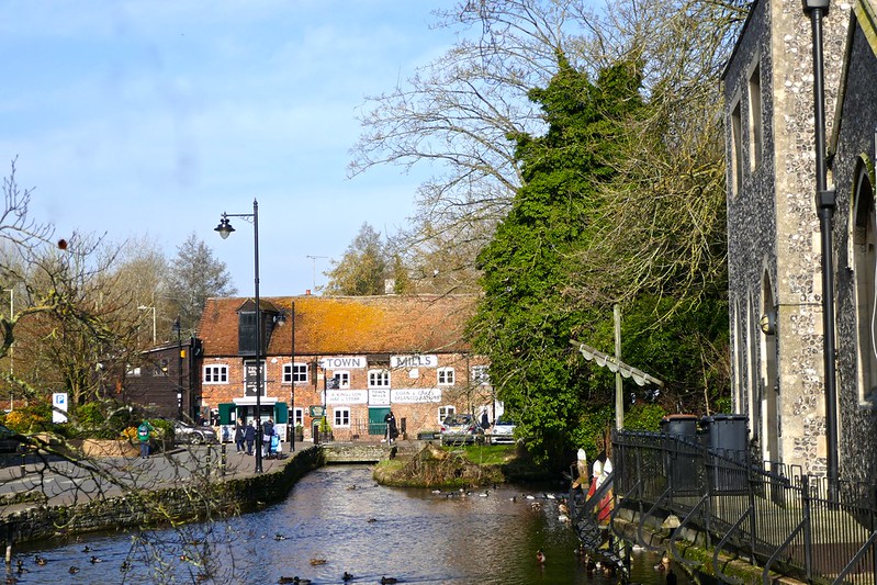 A stream with Town Mills in Andover in front.