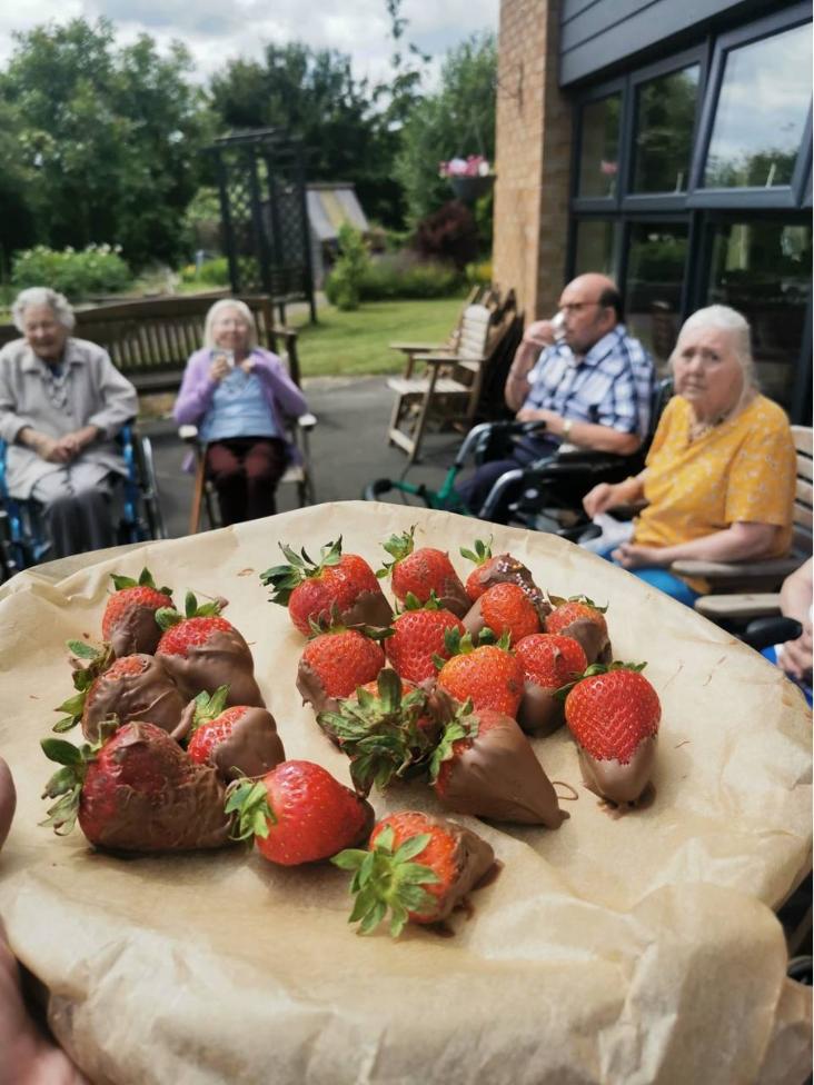 residents with chocolate strawberries