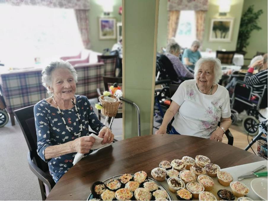 residents with decorated cupcakes