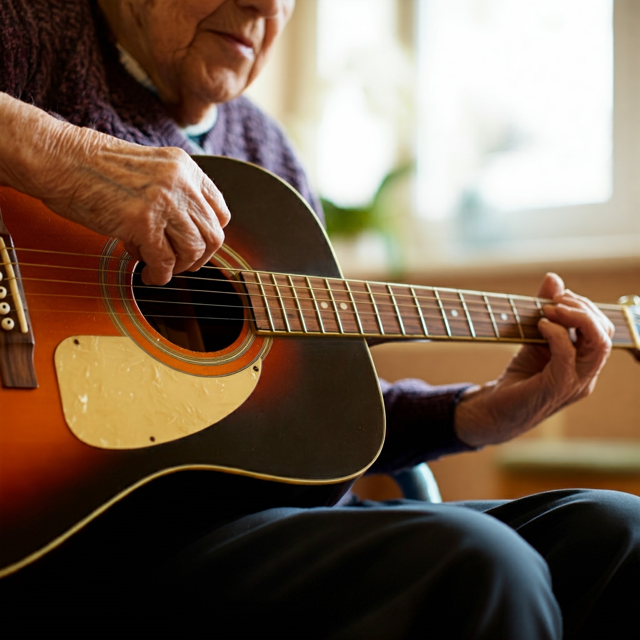 A resident playing guitar