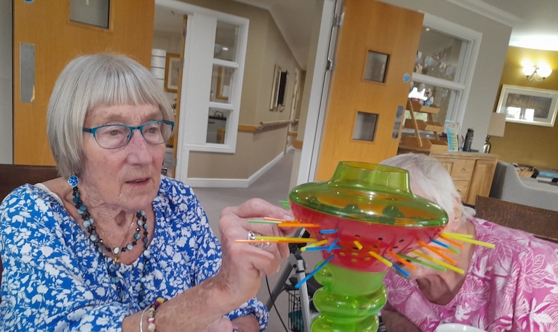 two of our residents playing kerplunk