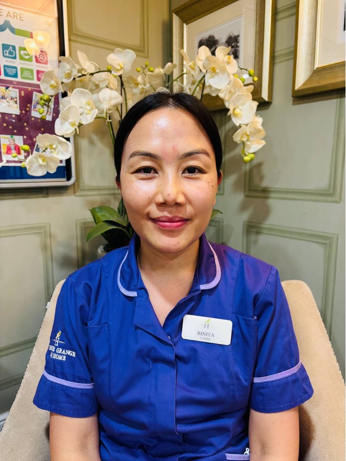 lady looking at camera posing for staff picture