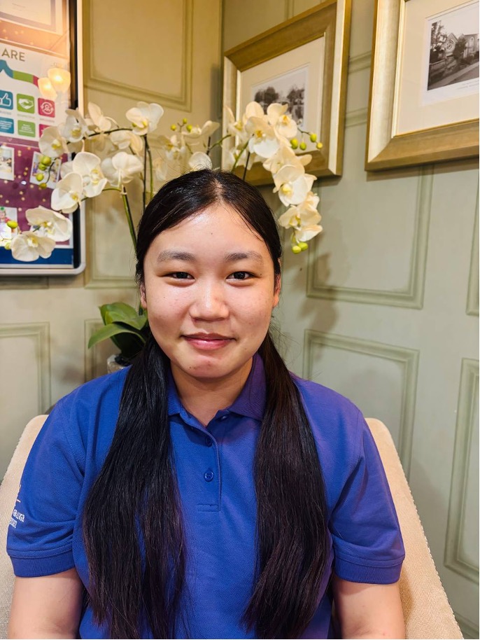 lady looking at camera posing for staff picture