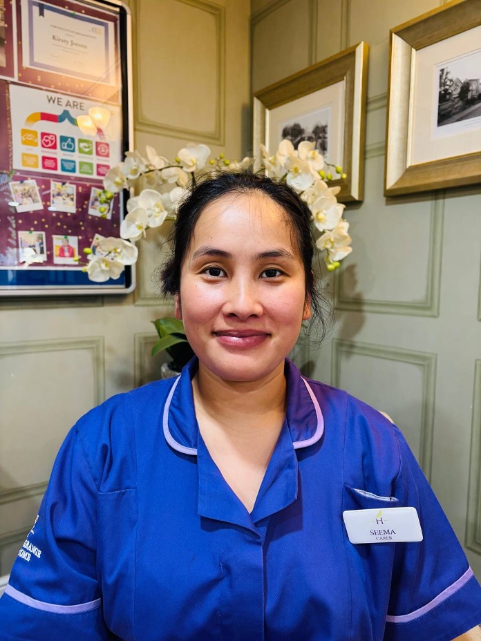 lady looking at camera posing for staff picture