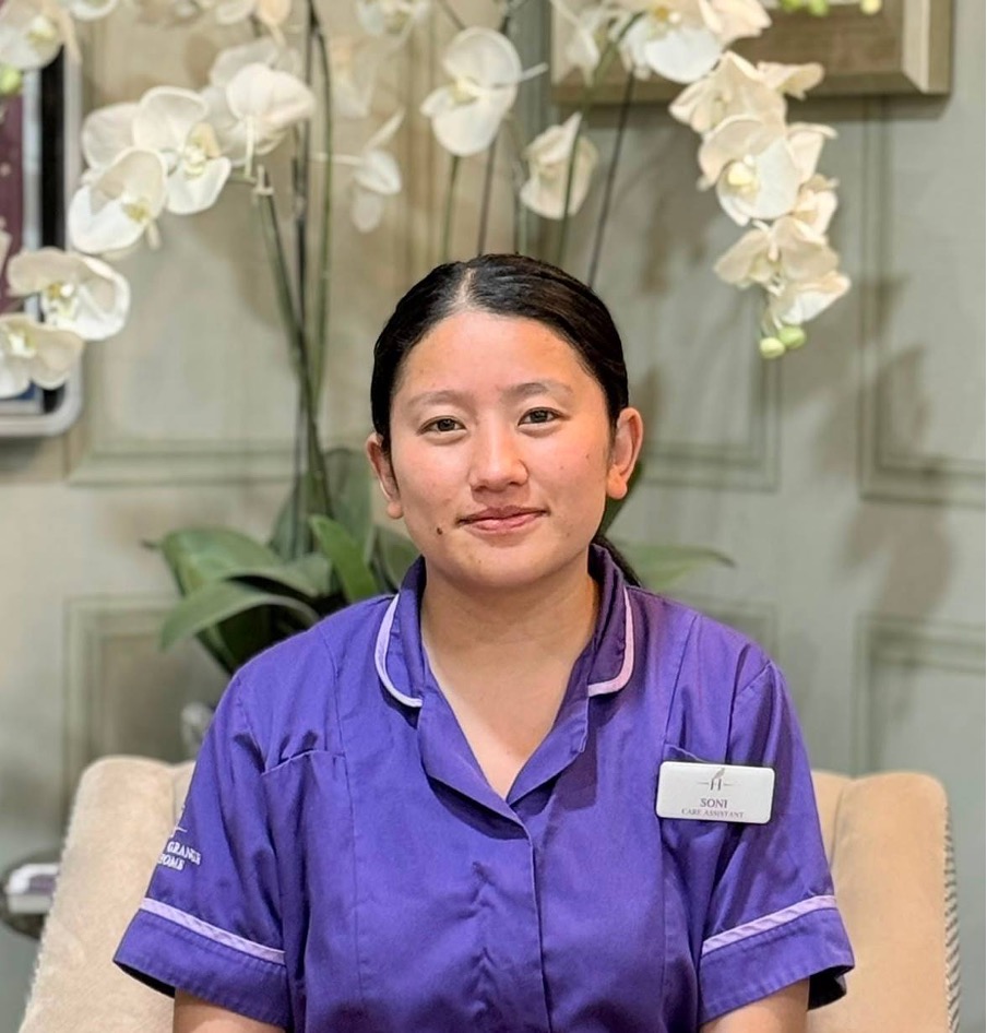 lady looking at camera posing for staff picture