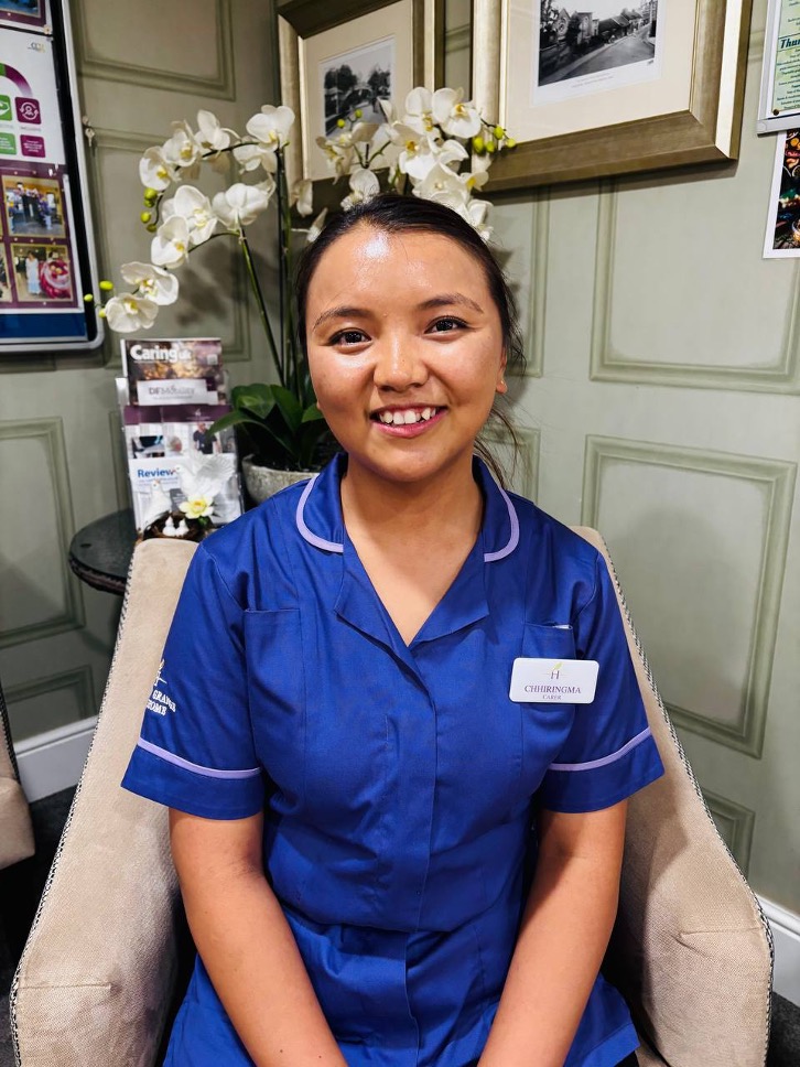 lady looking at camera posing for staff picture