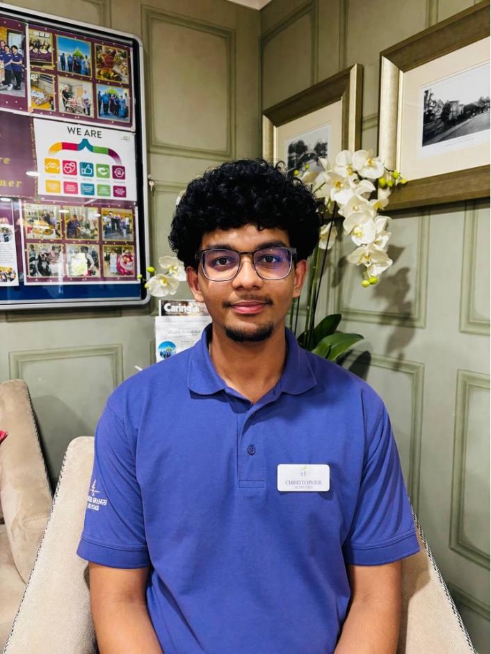 man looking at camera posing for staff picture