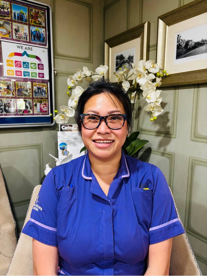 lady looking at camera posing for staff picture