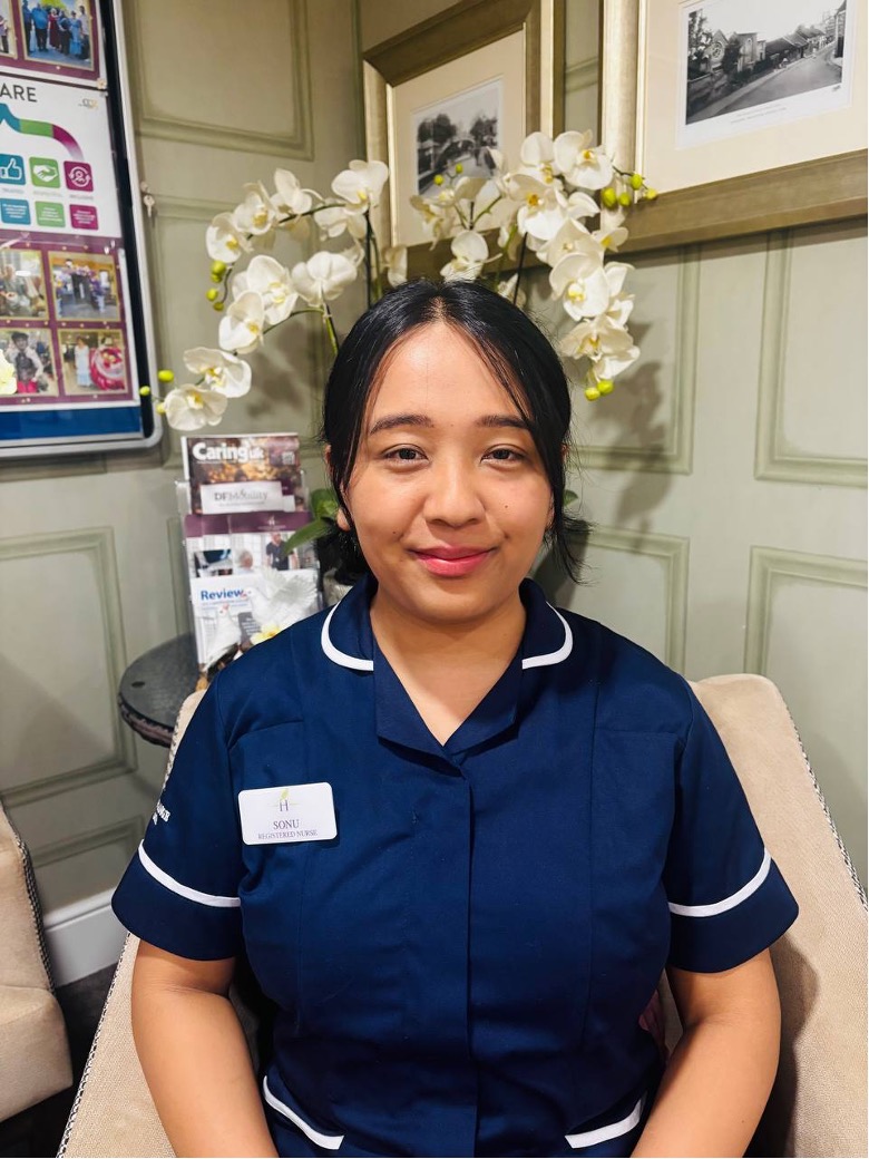 lady looking at camera posing for staff picture
