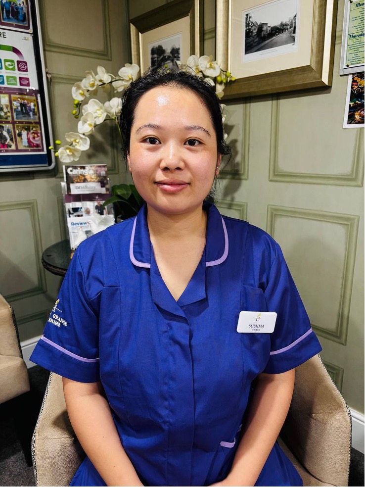 lady looking at camera posing for staff picture