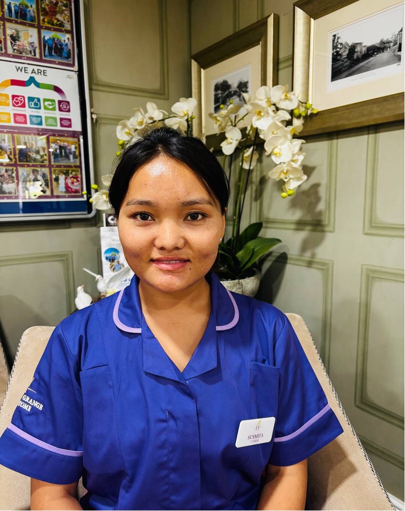 lady looking at camera posing for staff picture