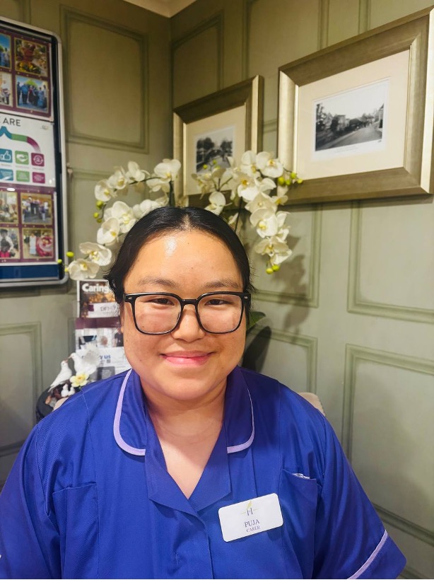 lady looking at camera posing for staff picture