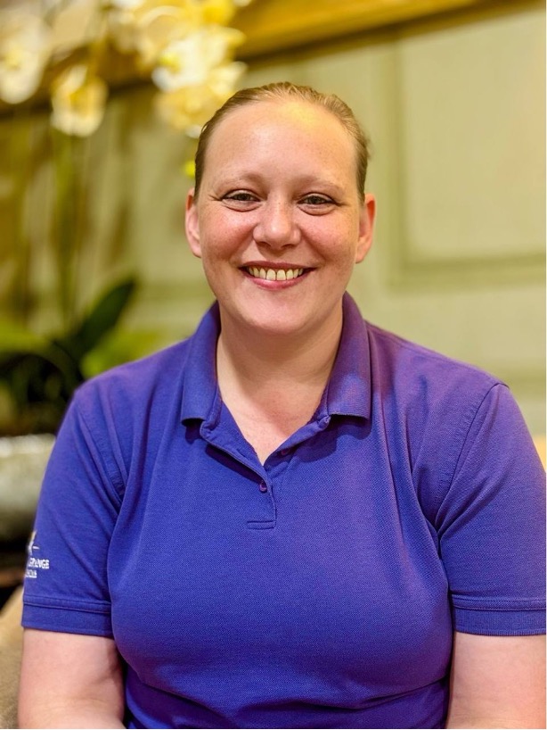 lady looking at camera posing for staff picture