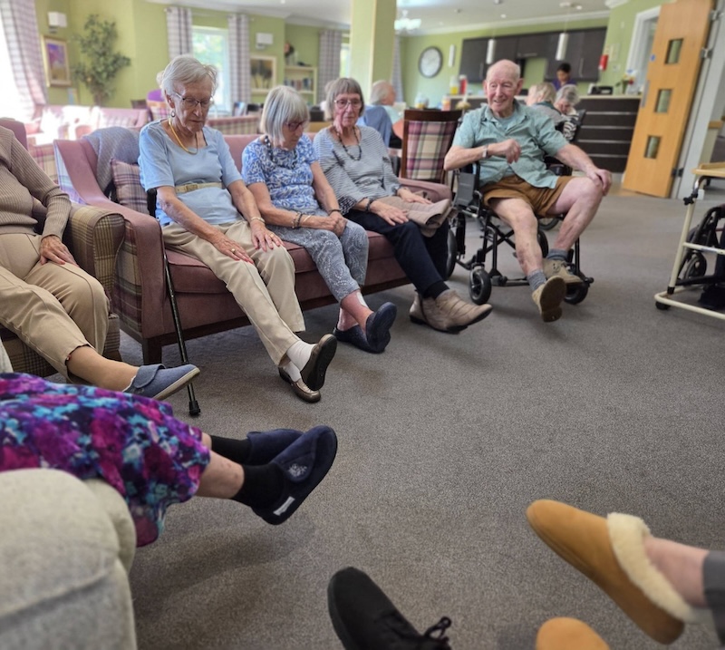 residents stretching sitting down